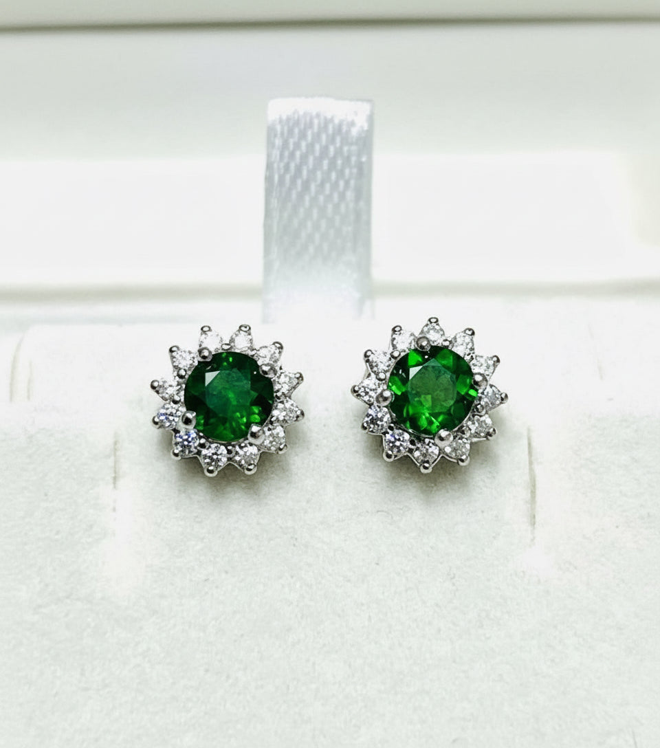  Bright green natural chrome diopside stud earrings surrounded by clear accent stones.