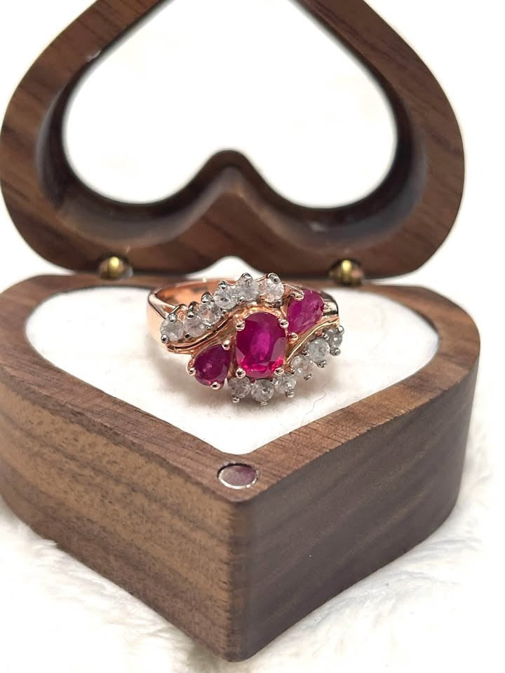 Exquisite ring with natural Burmese rubies and white topaz in 18K rose gold plated sterling silver, in a heart box.
