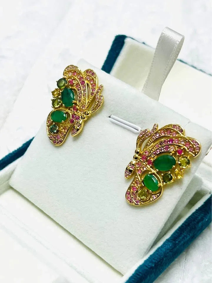18k gold butterfly earrings with Colombian emeralds and pink, blue, and yellow sapphires.