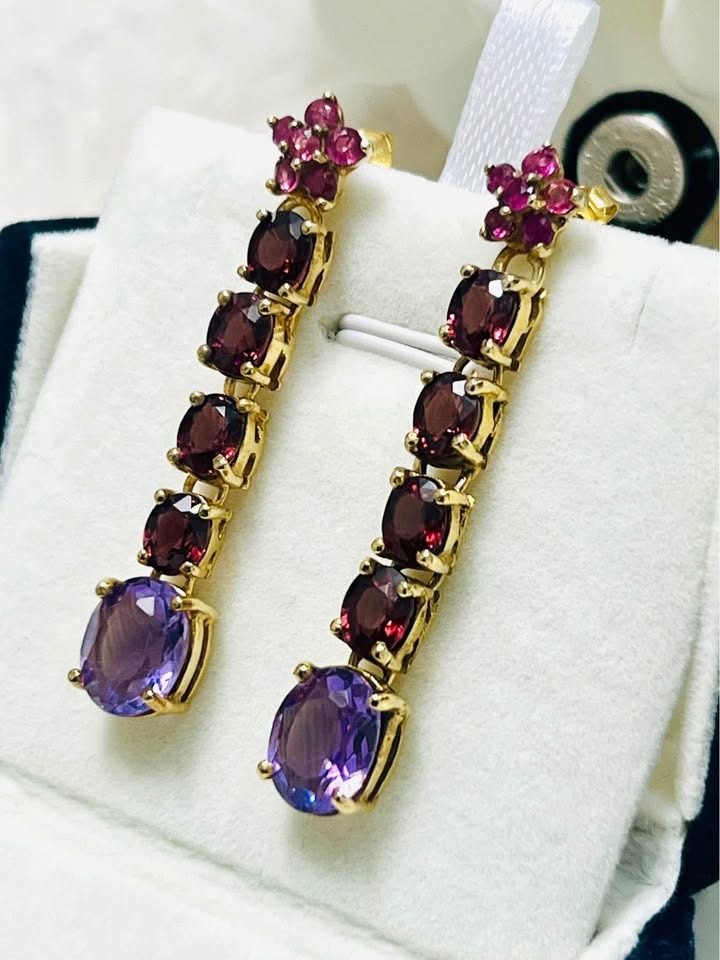 Luxurious David Y earrings with amethyst, rhodolite garnet, and ruby stones in a professional jewelry box setting.