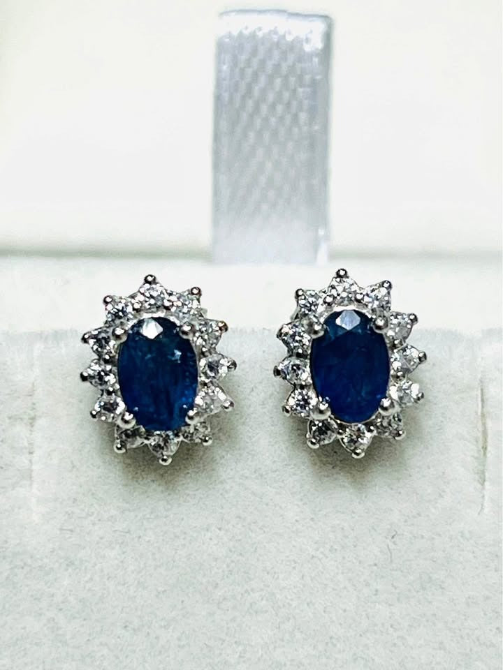 Deep blue natural sapphire halo stud earrings, perfect for elegant everyday wear or special occasions.
