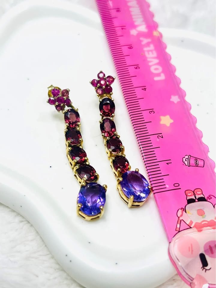 Designer David Y earrings with amethyst, rhodolite, and ruby, displayed with a ruler for size reference.