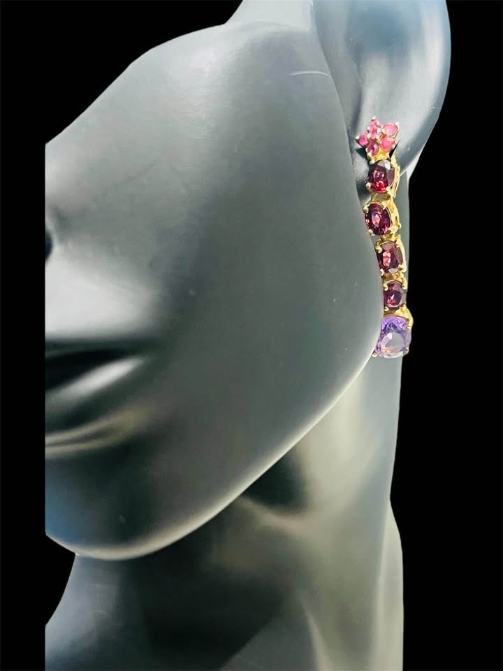  Designer David Y earrings with amethyst, rhodolite, and ruby gemstones on a model to show scale.