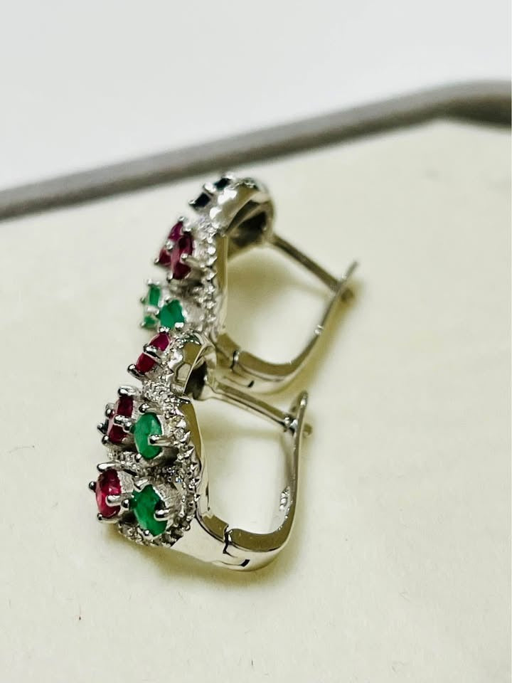Side view of Edwardian-style emerald, ruby, sapphire earrings, showcasing the lever-back clasp