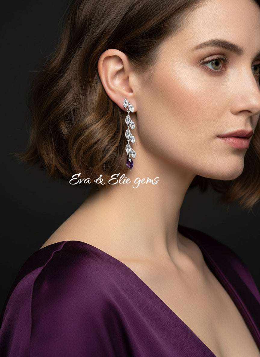 Elegant dangle earring with aquamarine and a single marquise amethyst, shown on a black mannequin.