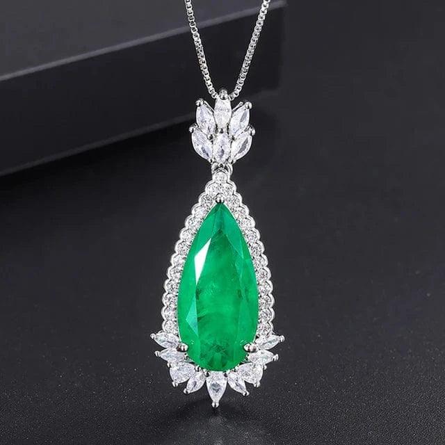 Glamorous emerald doublet pendant with a captivating green tear-shaped gem and brilliant white accent stones.