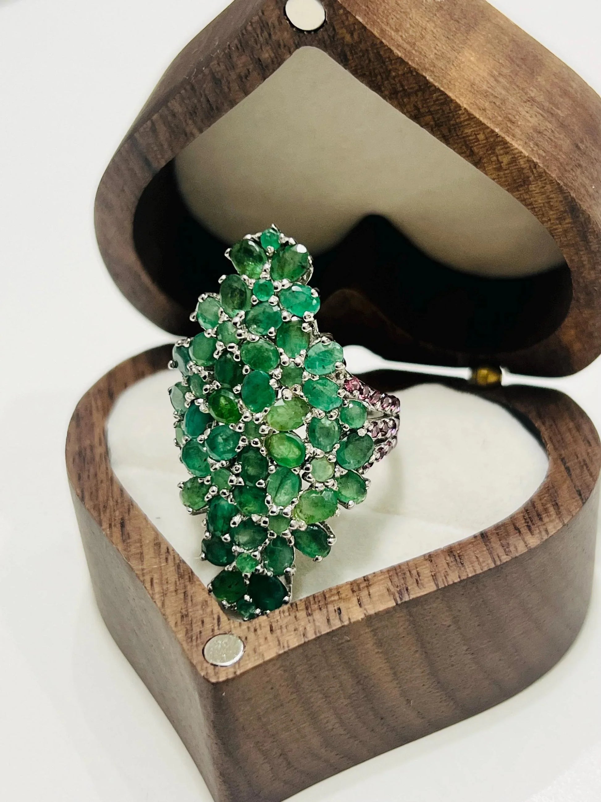 Back view of the emerald and rhodolite bouquet ring, showing the craftsmanship of the silver band.