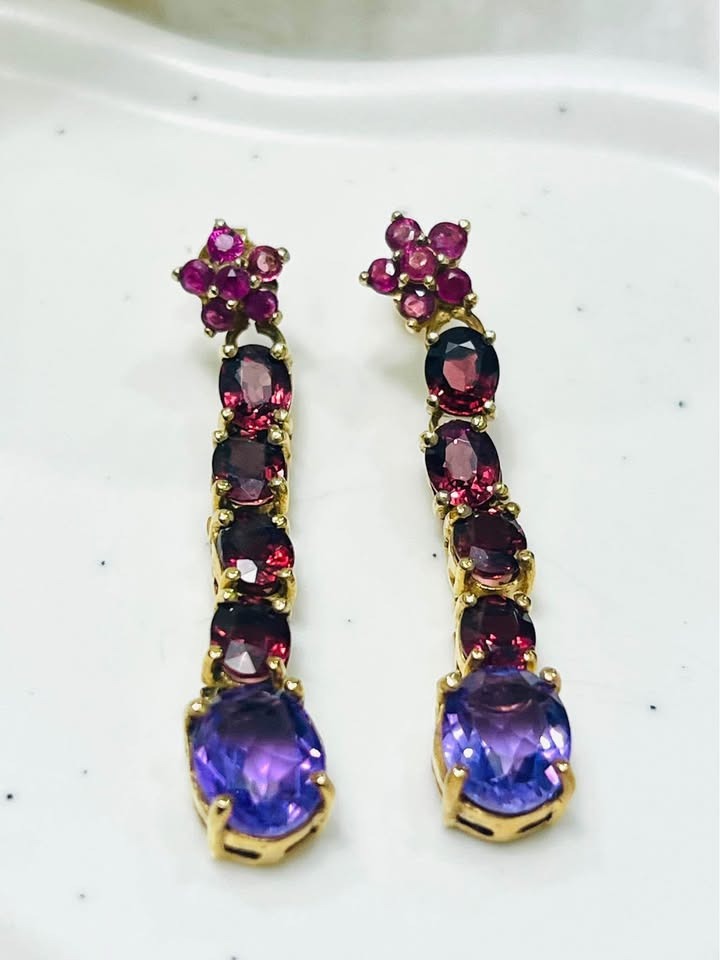  Genuine amethyst, rhodolite garnet, and ruby earrings by designer David Y, on a white surface.