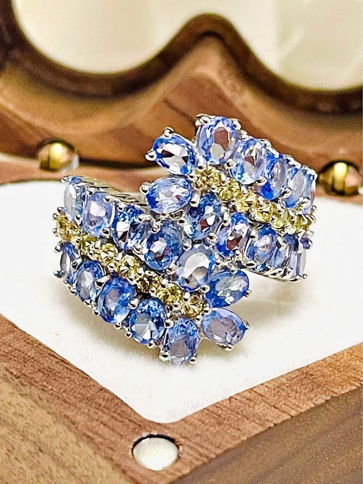 A genuine tanzanite and sapphire cocktail ring featuring multiple oval-cut gems and a dazzling, modern design.