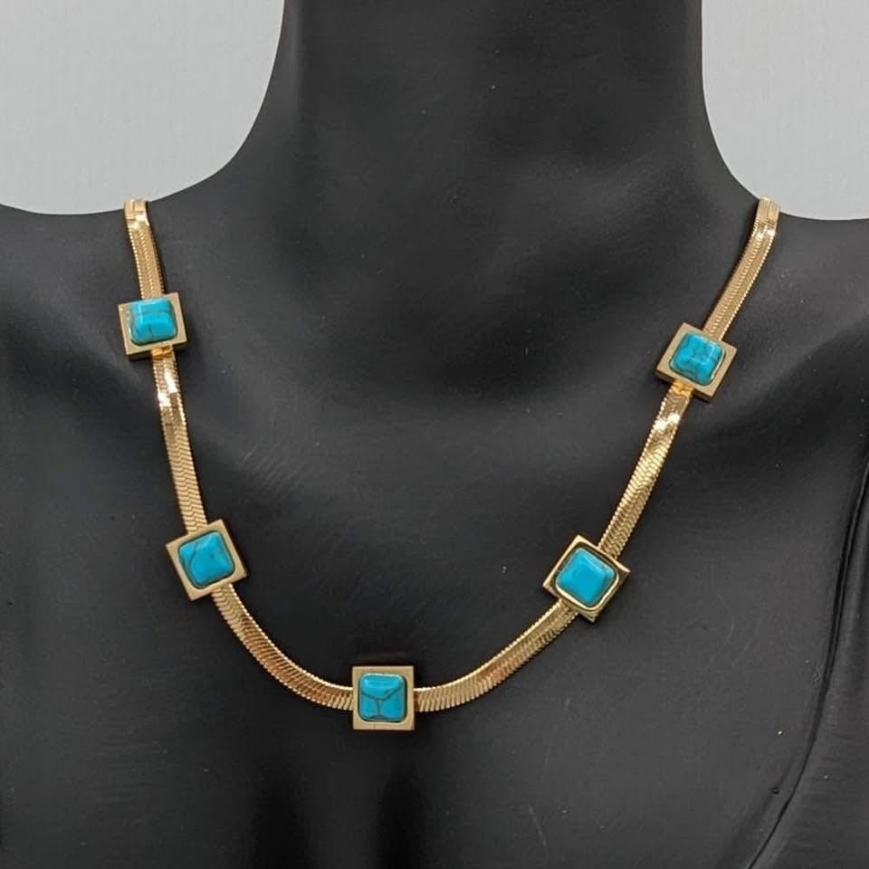 18k gold vermeil waterproof turquoise chain necklace displayed on a black mannequin.