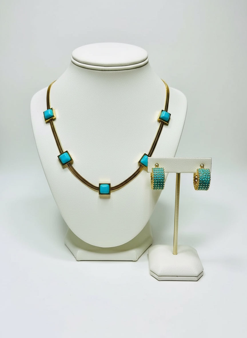  Full view of 18k gold vermeil waterproof turquoise chain and huggie hoops on white.
