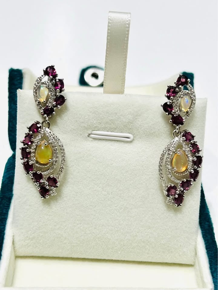 Full view of handcrafted fire opal and rhodolite garnet vintage-inspired dangle earrings.