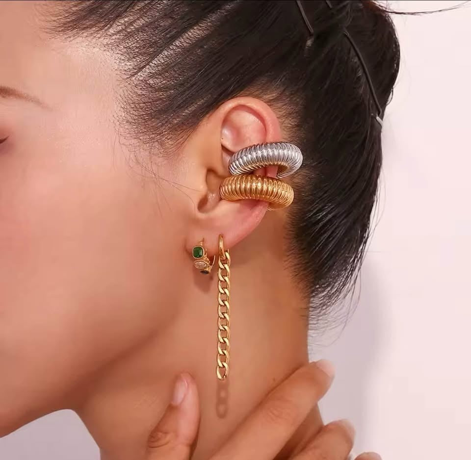 Stylish ear party look with a gold vermeil huggie earring, long chain drop, and layered ridged ear cuffs.