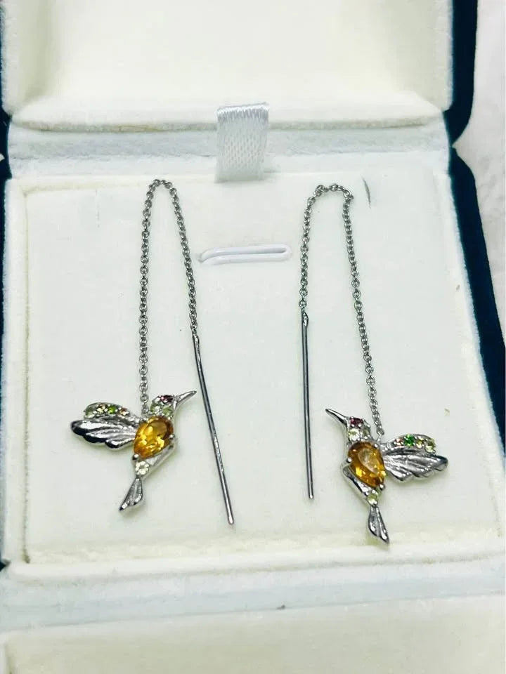 Silver hummingbird ear threader earrings with citrine and peridot gemstones, presented in a gift box.