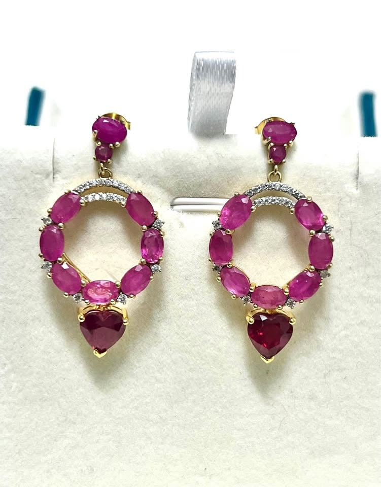 Stunning Italian 10 carat genuine ruby dangle earrings, featuring an oval ruby circle and heart-shaped ruby drops.