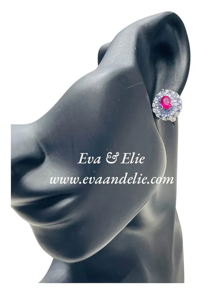 Model showcasing sterling silver tanzanite and ruby earrings. Eva & Elie