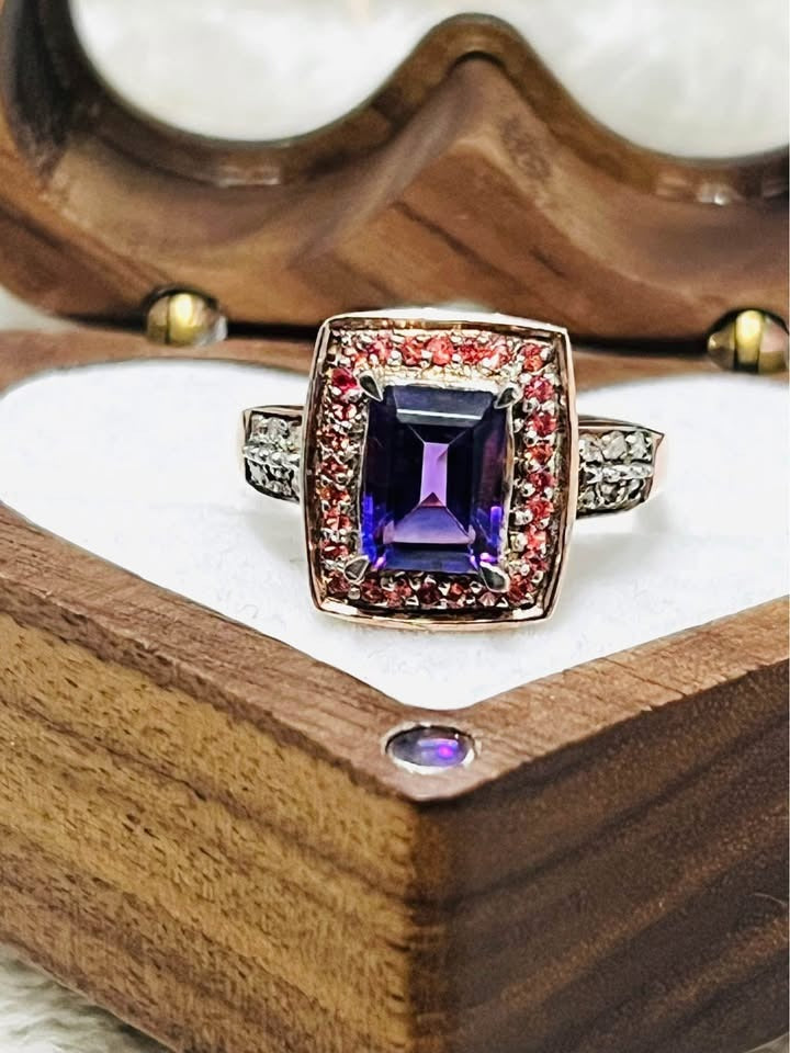 Exquisite natural amethyst and diamond ring in rose gold, centered in a heart-shaped wooden box.