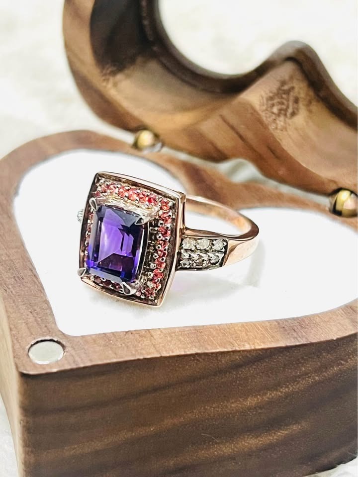 Elegant natural amethyst and diamond ring showcasing rose gold setting and sparkling diamond shoulders.