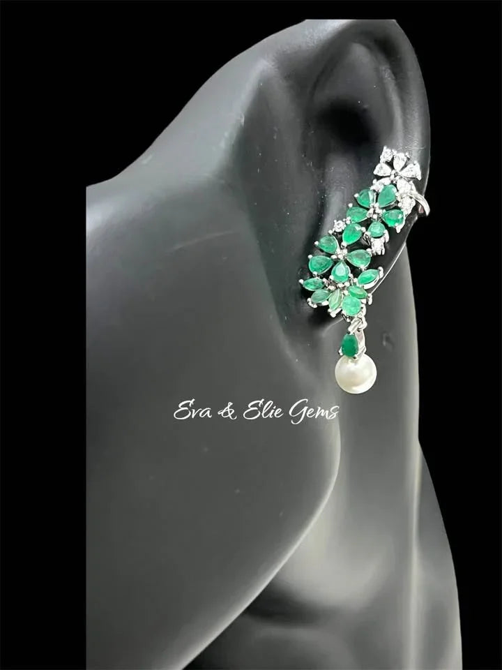  Natural emerald ear climber with pearl drop on black mannequin, elegant green and white jewelry.