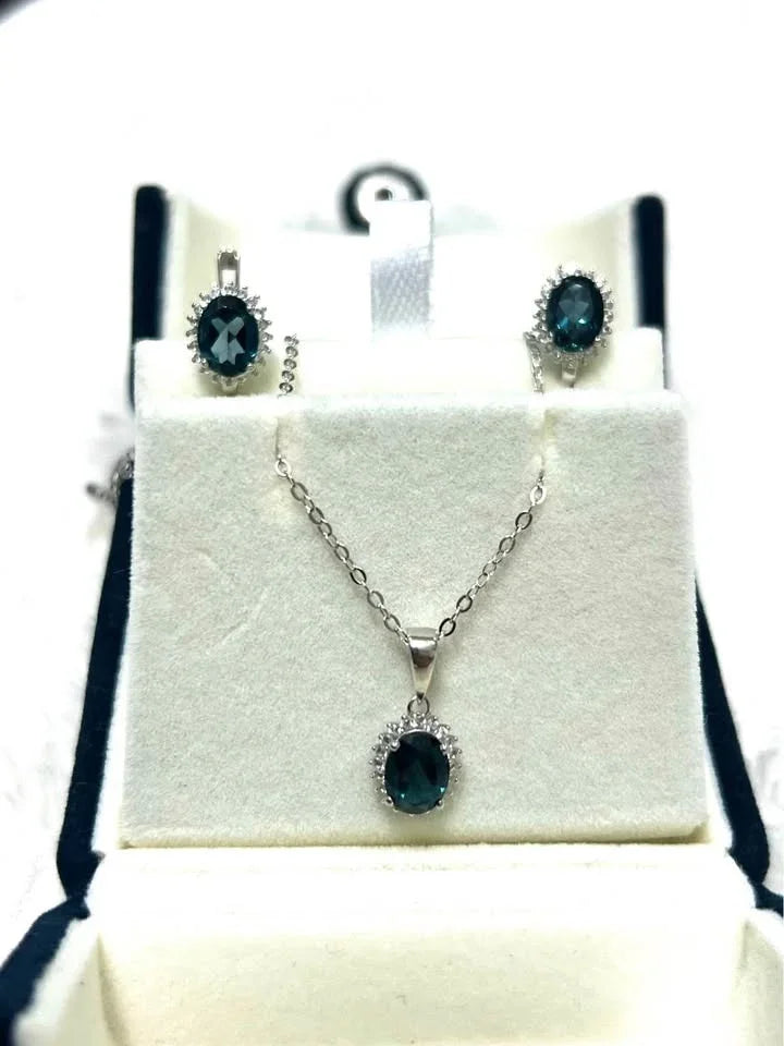 Stunning natural London blue topaz necklace and earring set in sterling silver.
