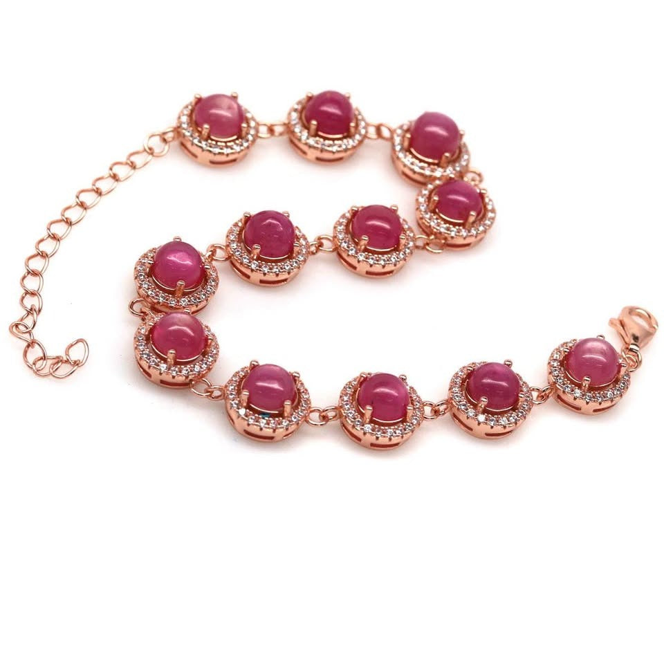  Women's tennis-style bracelet with genuine pink rubies and sparkling cubic zirconia on a white background.
