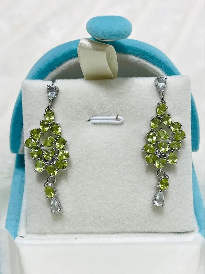 Pair of natural peridot and aquamarine gemstone earrings with a sparkling, eye-catching cluster design.