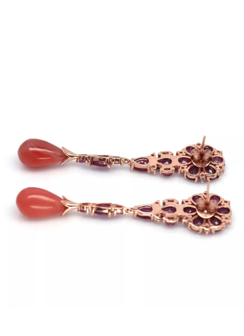 Back view of prehnite and ruby dangle earrings, showing the post and findings on a white background.