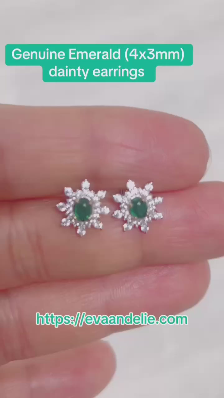 Brilliant emerald and white topaz halo stud earrings in a silver-toned setting.