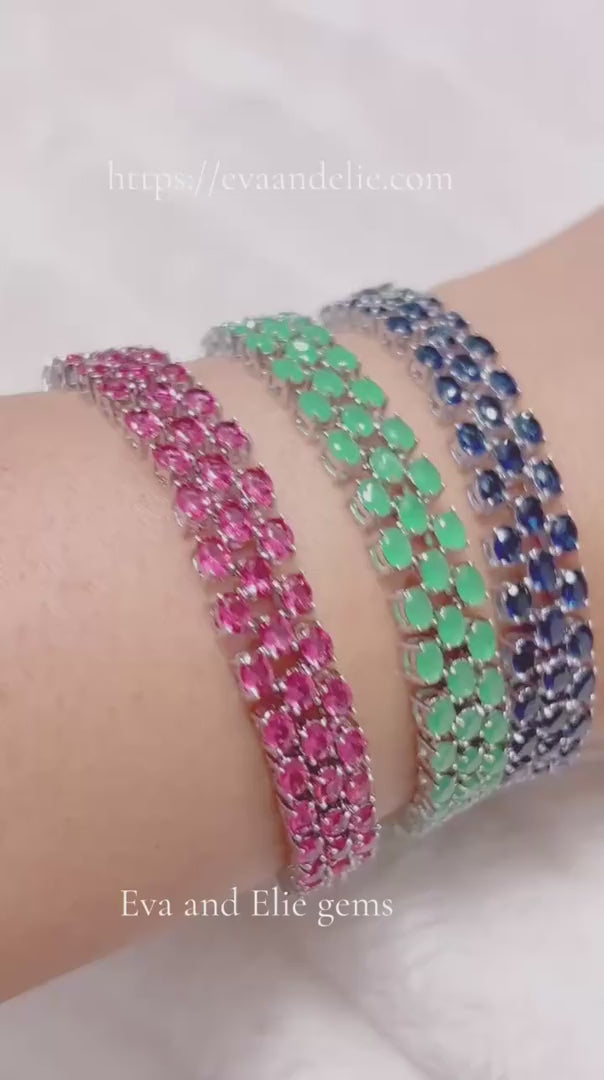 Video showcasing handcrafted gold-plated sterling silver gemstone bracelets either with created sapphire, emerald, or pink tourmaline