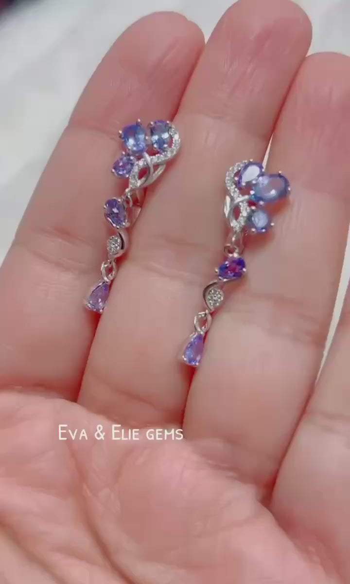  Elegant sterling silver drop earrings with multiple genuine tanzanite gemstones.