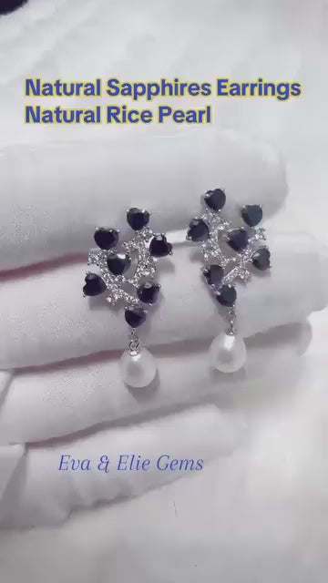 Sterling silver earrings with a floral sapphire design and dangling genuine pearls.