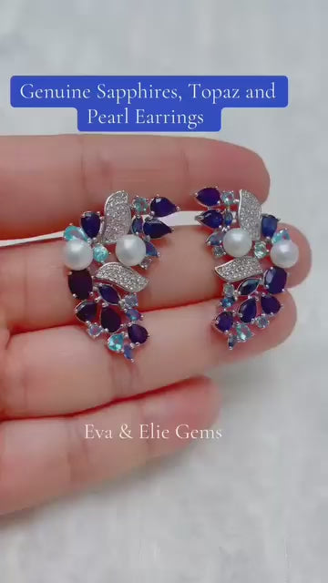 Stunning earrings featuring a unique cluster of genuine sapphires, topaz, and pearls.