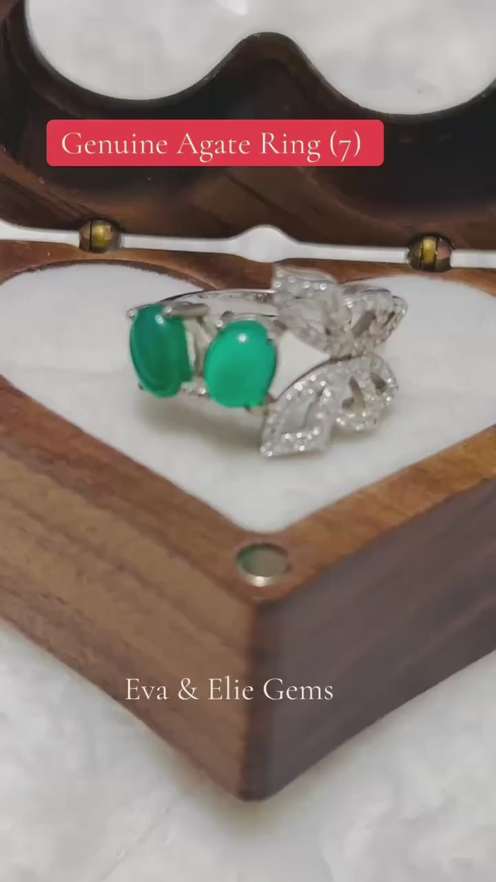 Beautiful sterling silver ring with natural green agate stones, nature-inspired design.