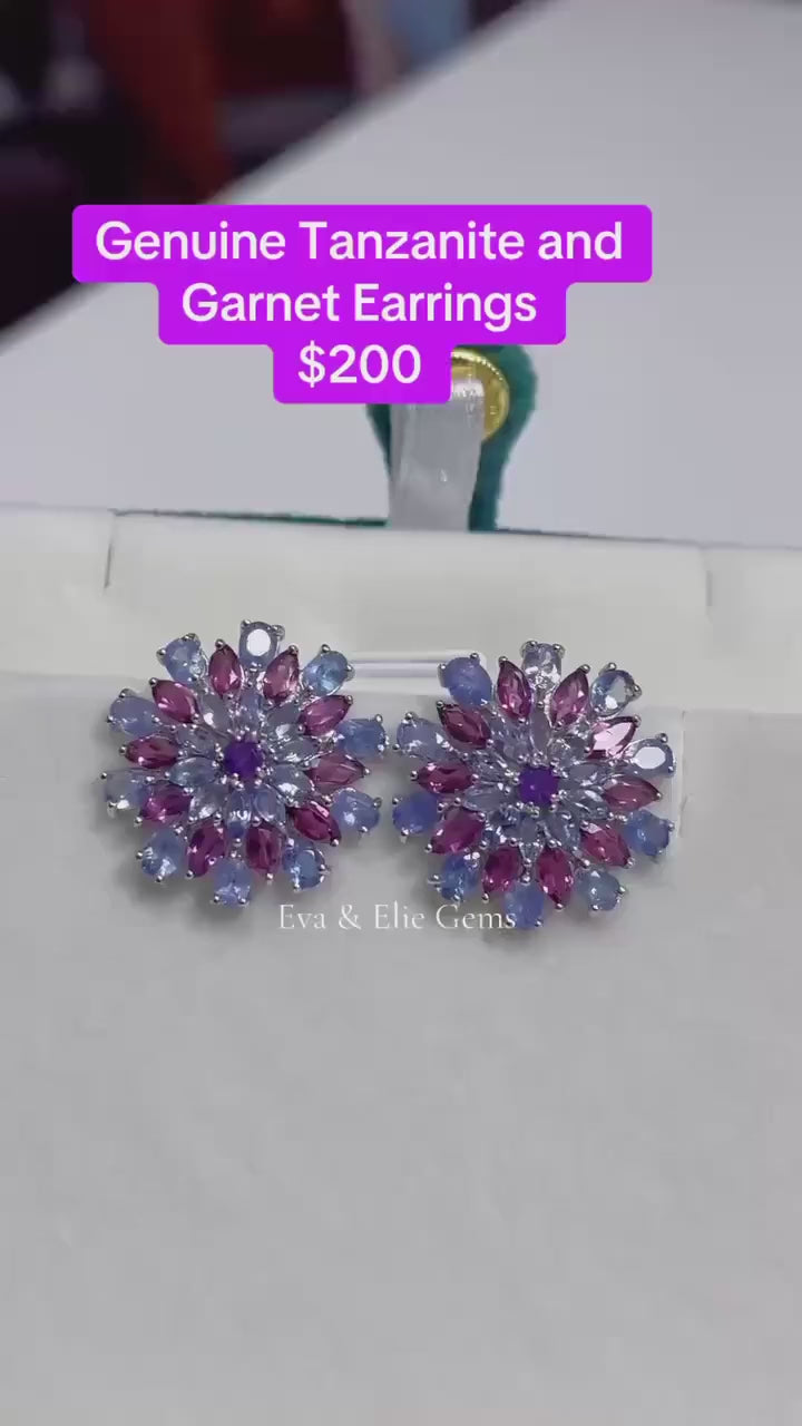 Sparkling Tanzanite and Garnet flower earrings from Eva & Elie Gems. Vibrant purple & pink.
