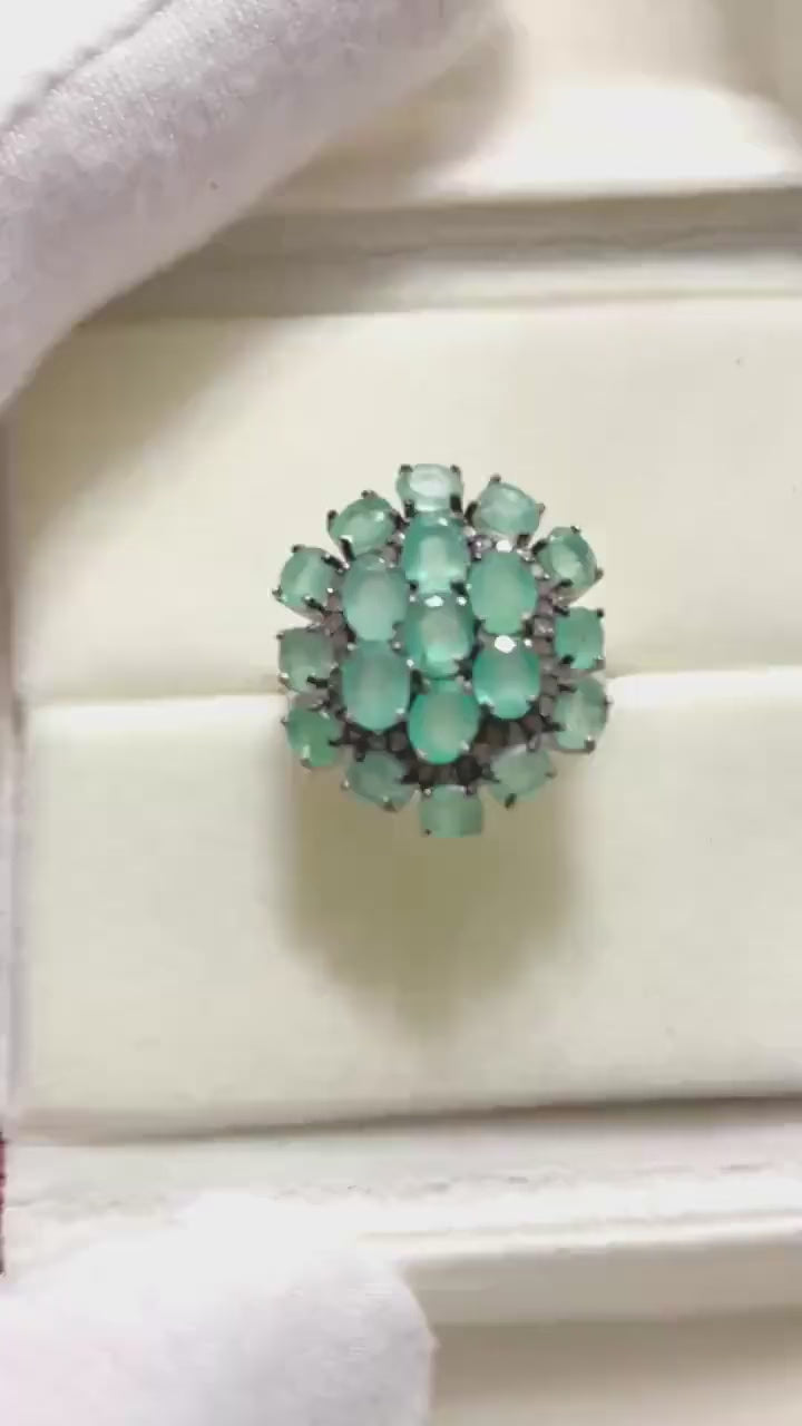  Beautiful genuine Emerald and Diamond cluster ring. A sparkling statement piece.