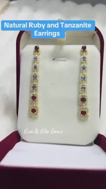 A pair of fancy, long sterling silver earrings with a beautiful cascade of rubies and tanzanite.