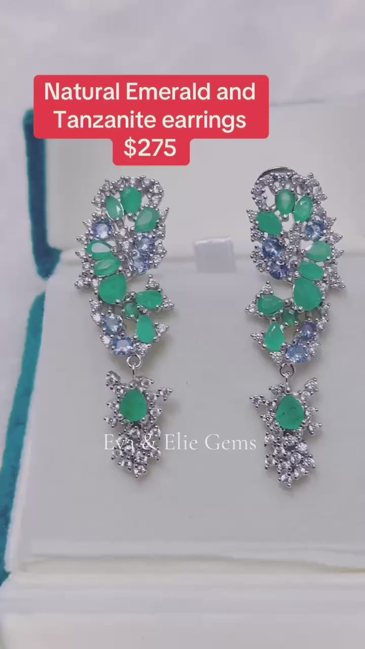 Fancy dangling earrings with a beautiful combination of natural emerald and tanzanite gemstones