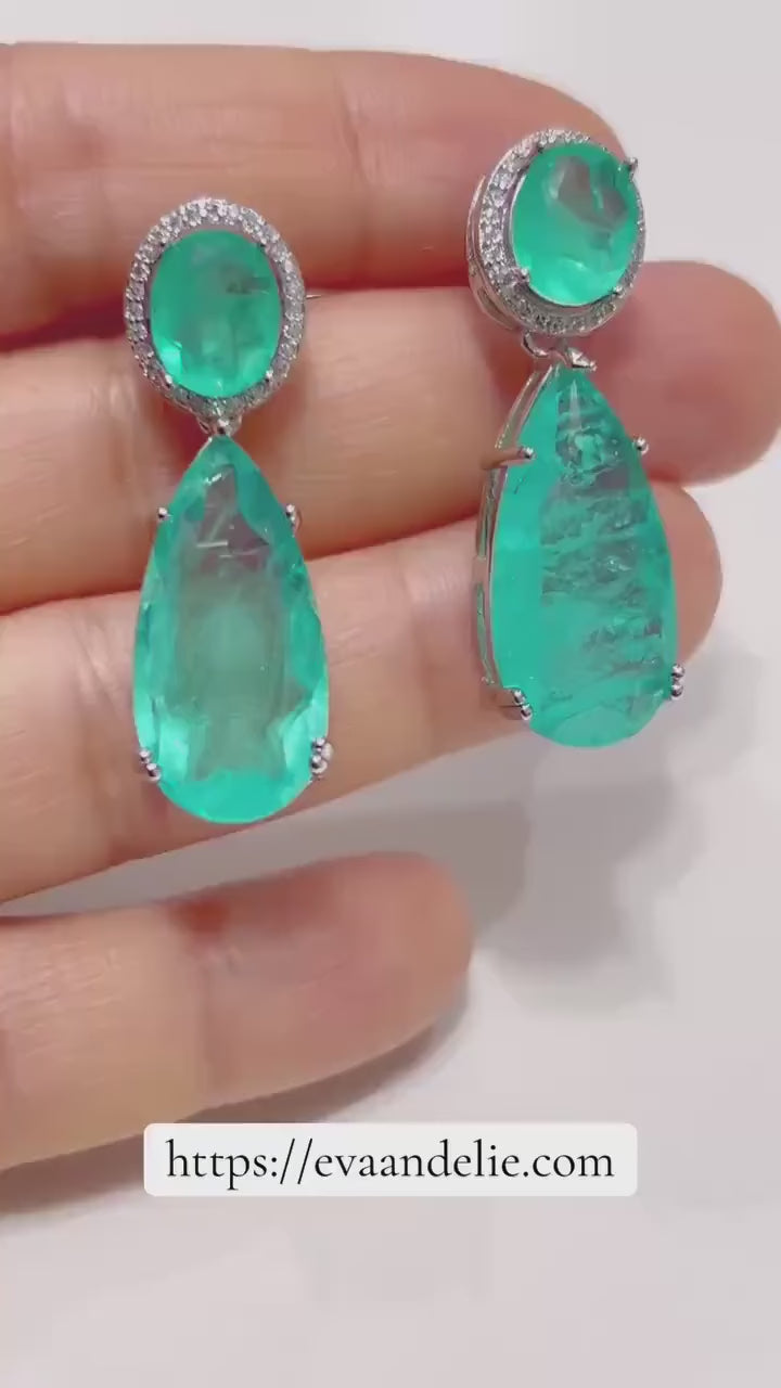 Handcrafted luxury teal Paraiba tourmaline and diamond earrings. Dazzling statement jewelry.