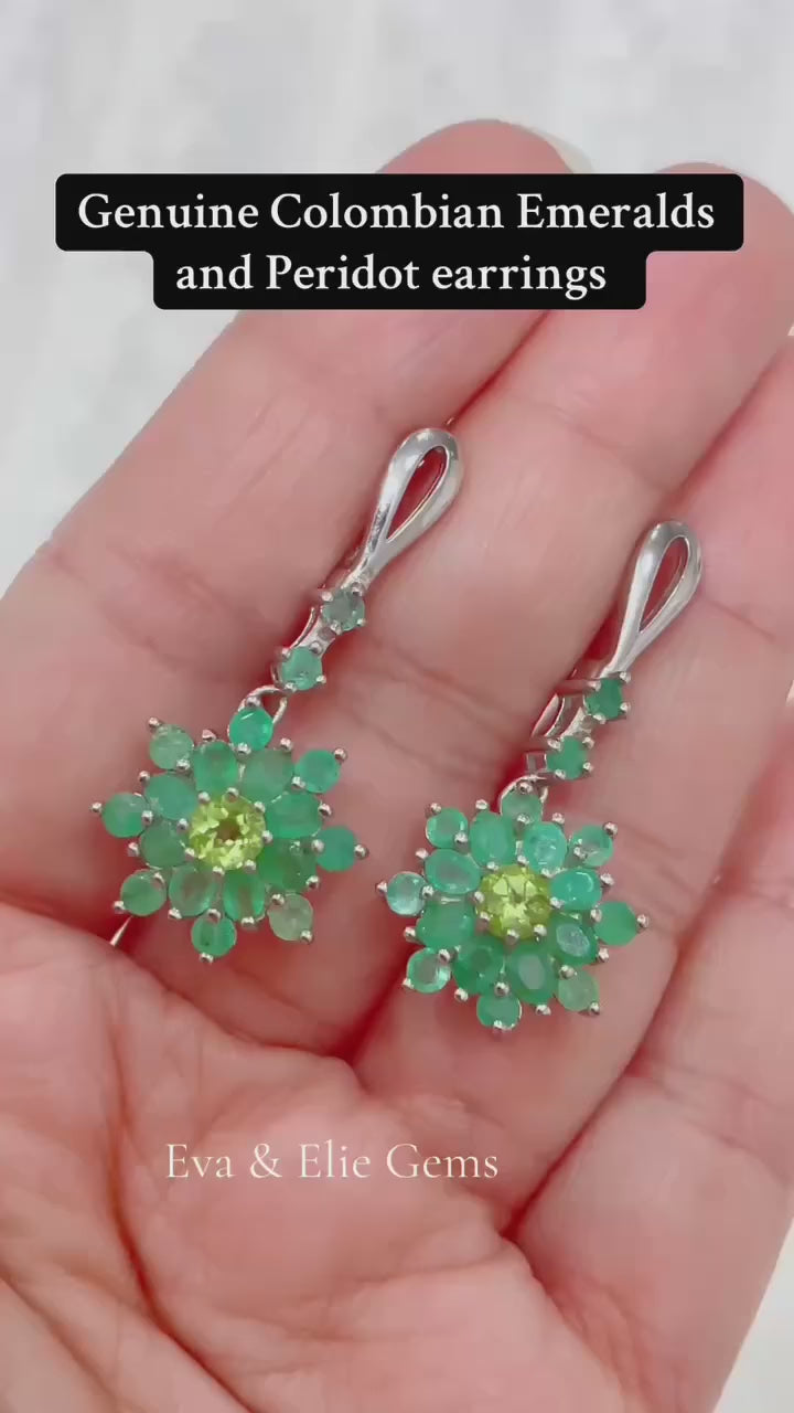 Beautiful floral-design earrings with vibrant green Colombian emeralds and peridot.
