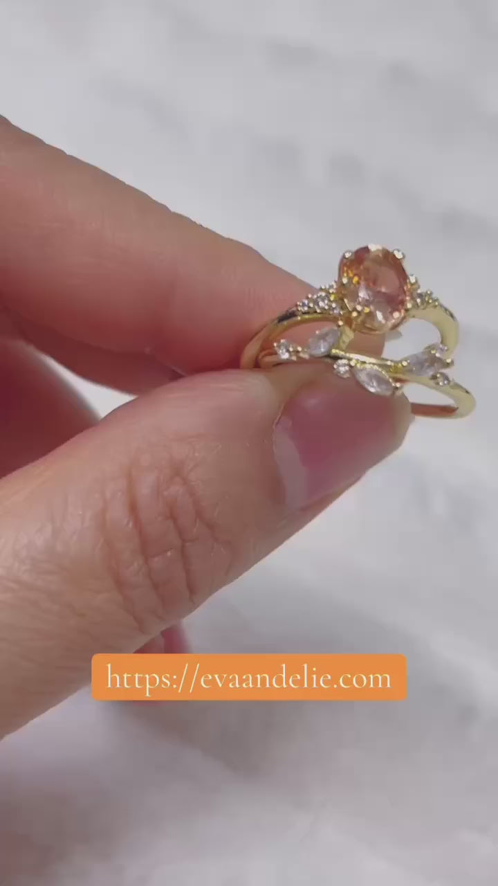 Beautiful two-piece ring set with peach gemstone and leaf design.