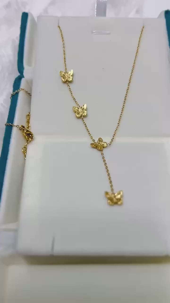 Elegant 18k gold vermeil butterfly lariat necklace with delicate charm details.