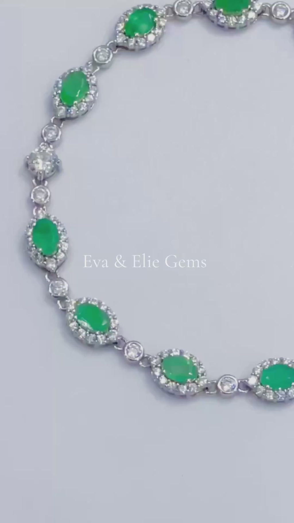 Beautiful sterling silver tennis bracelet adorned with vibrant Colombian emeralds, perfect for a touch of green elegance