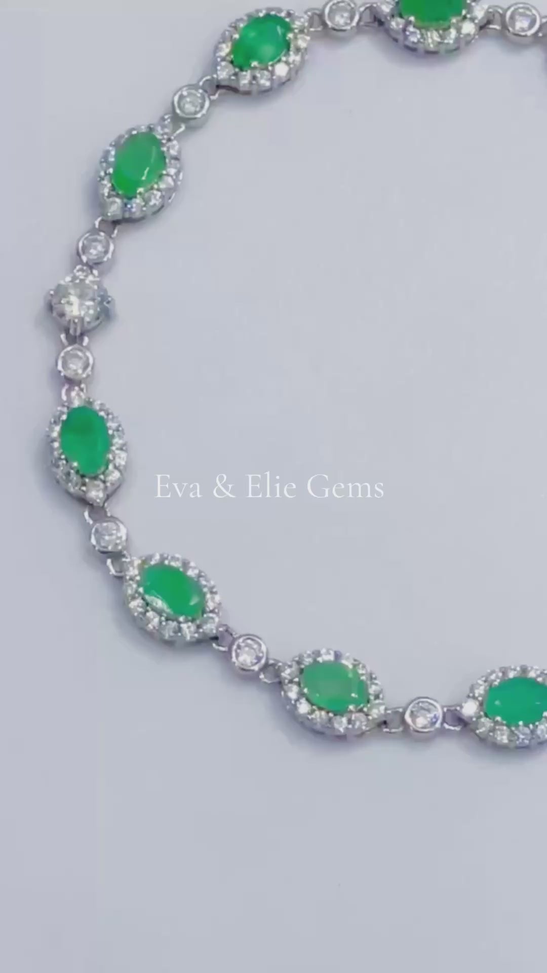 Beautiful sterling silver tennis bracelet adorned with vibrant Colombian emeralds, perfect for a touch of green elegance