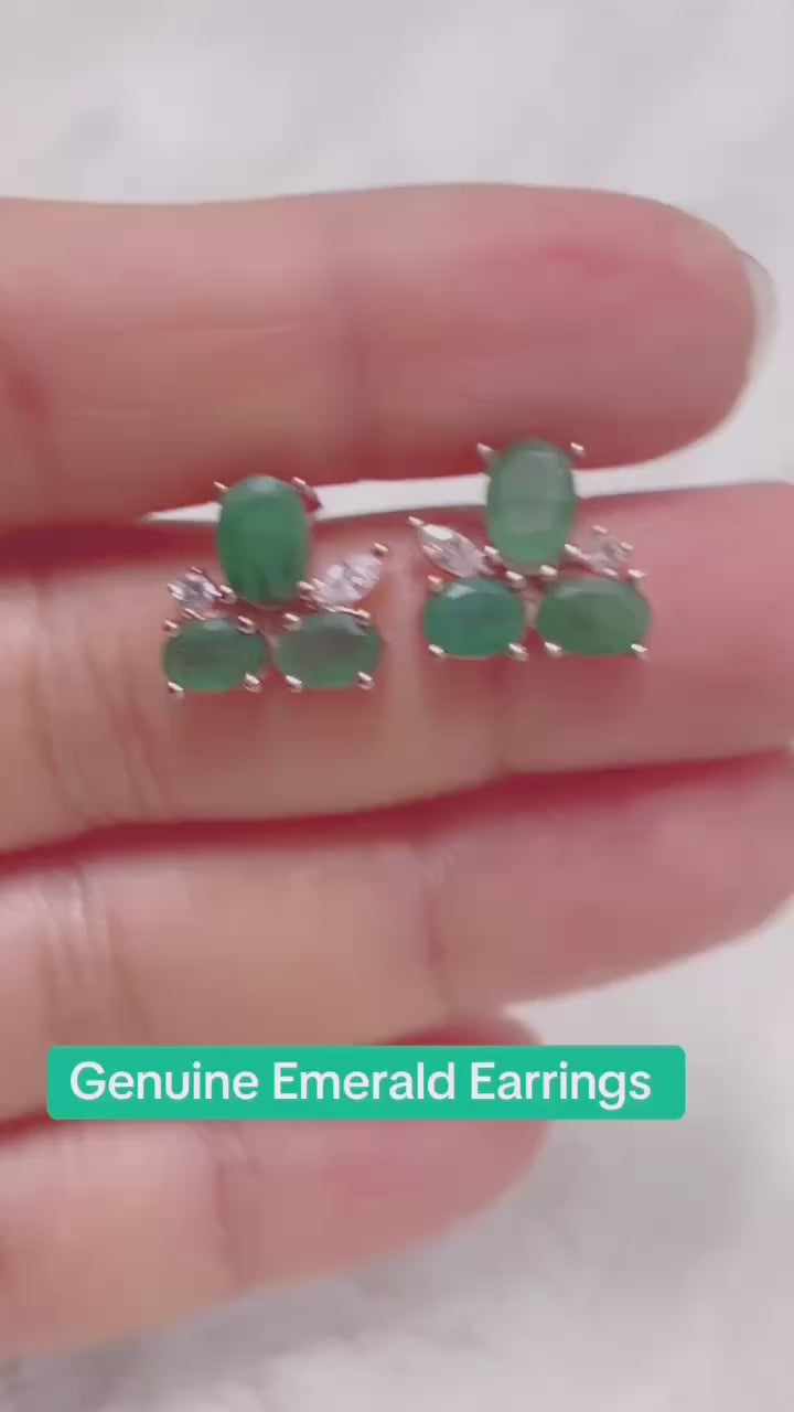 Beautiful natural emerald earrings in a delicate cluster design.