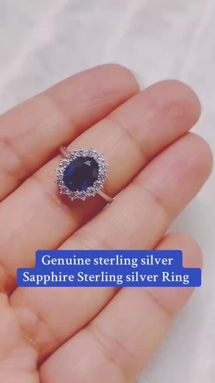 Genuine sterling silver ring with a stunning blue sapphire and halo.