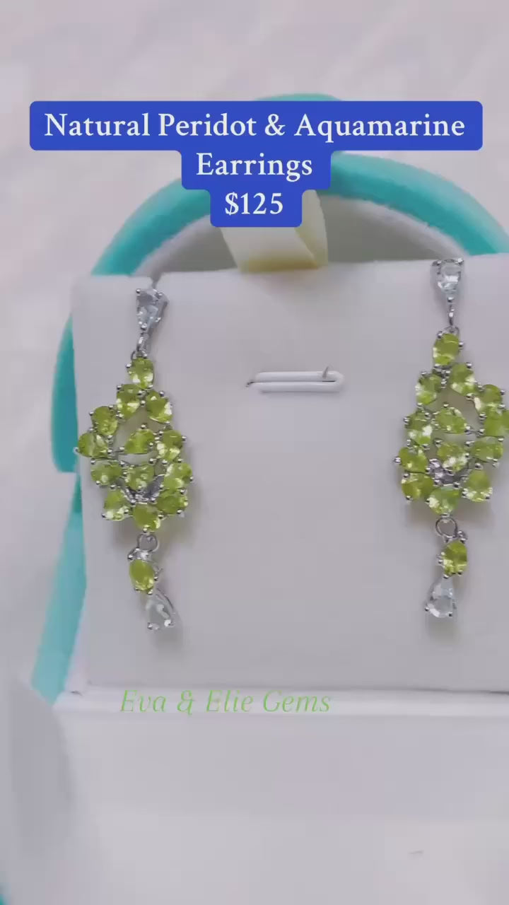 Stunning dangle earrings featuring a beautiful mix of natural peridot and aquamarine gemstones.