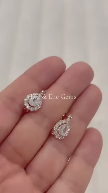 Sparkling 14k white small pear-shaped halo earrings by Eva & Elie Gems.