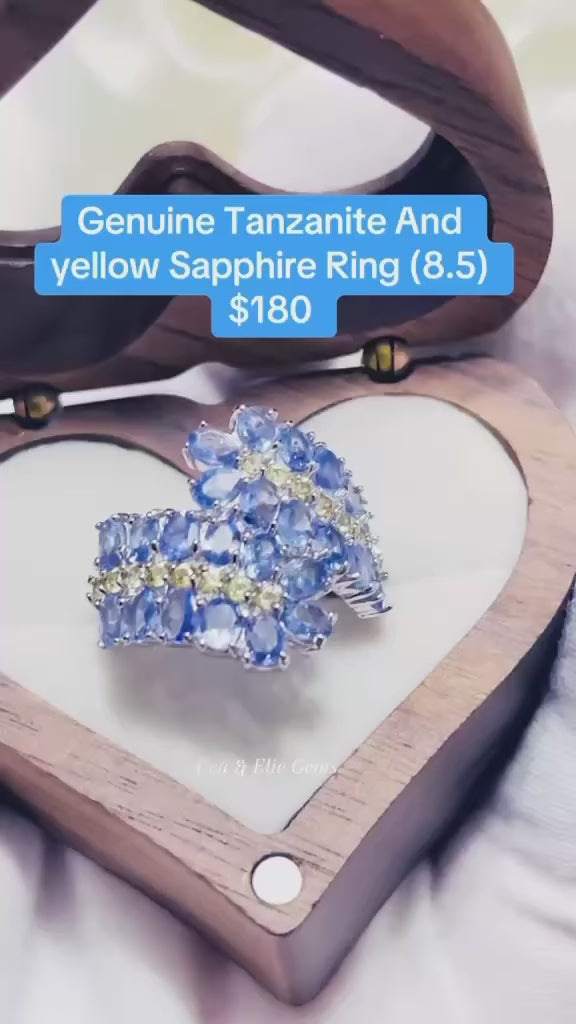 An elegant ring with genuine tanzanite and sapphire gemstones, perfect for any occasion.