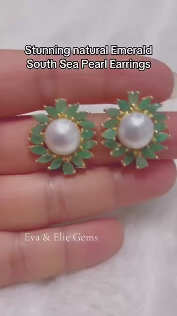 Elegant sterling silver natural emerald and South Sea pearl drop earrings.