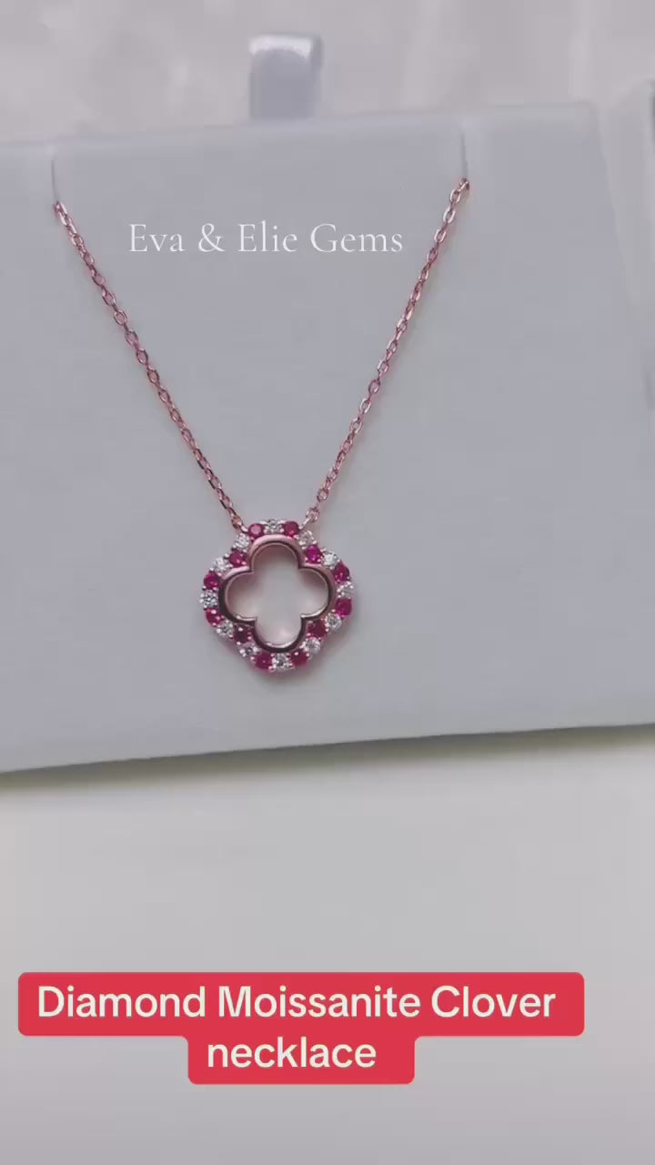Sterling silver clover necklace with dazzling ruby and moissanite stones.